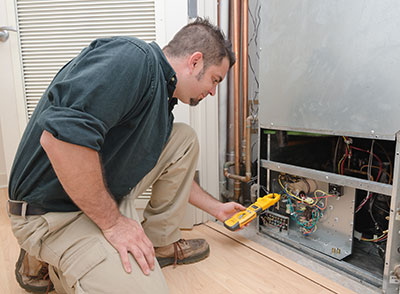 heater technician performing routine maintenance