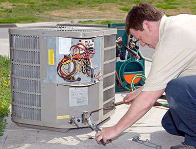 hvac technician installs heater repalcement